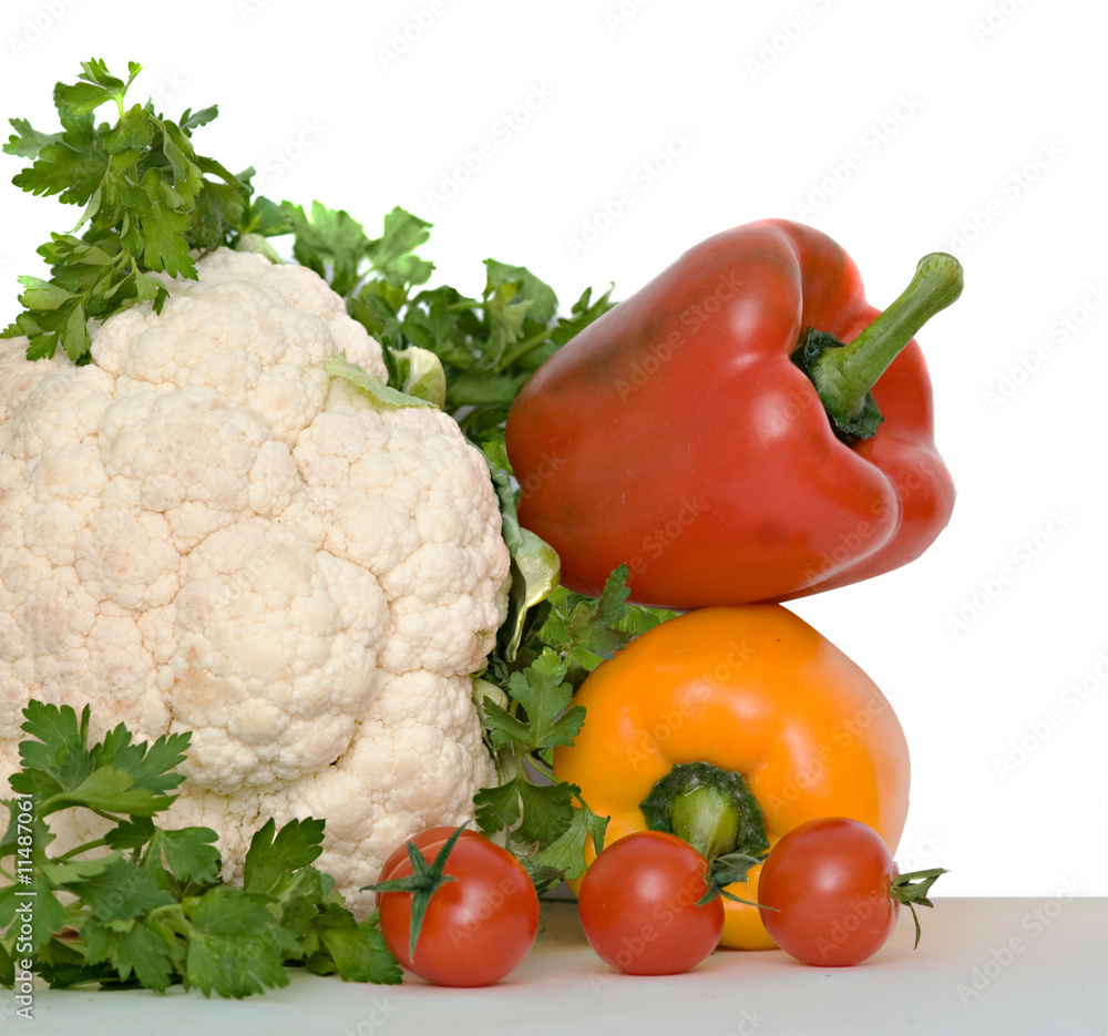 Cauliflower, cherry tomatoes, bell peppers, and parsley isolated Cauliflower, cherry tomatoes, bell peppers, and parsley isolated