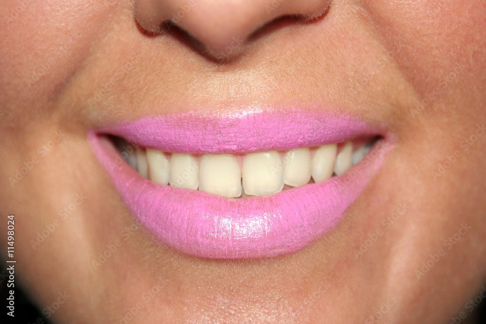 Obraz premium Close up of smiling womans mouth and teeth