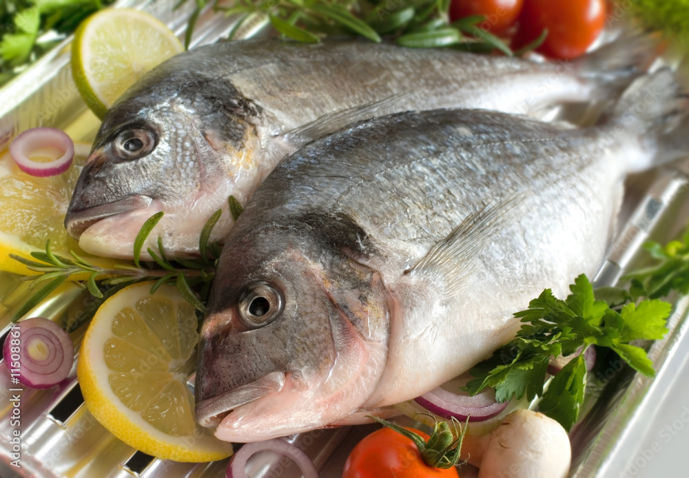 Fresh glitheads fish close up with vegetables Fresh glitheads fish close up with vegetables