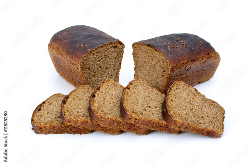 Two halves of rye bread with anise and some slices Two halves of rye bread with anise and some slices