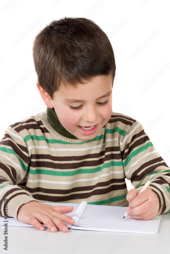Adorable child writing in the school Adorable child writing in the school