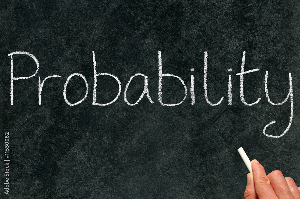 Fotografia A math teacher writing probability on a blackboard.