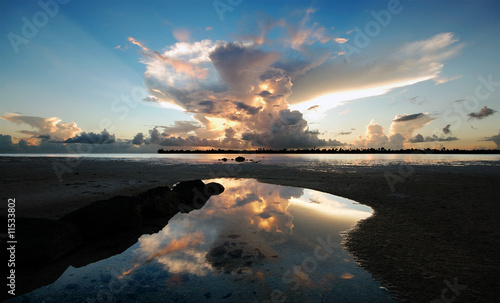 Sunset - reflection of clouds on water