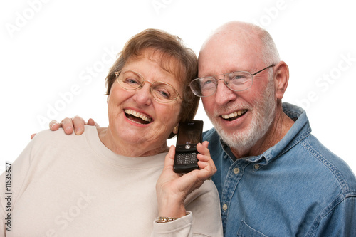 Happy Senior Couple Using C...
