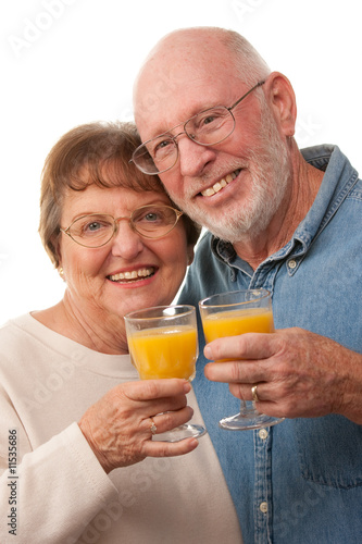 Senior Couple with Glasses of Orange Juice