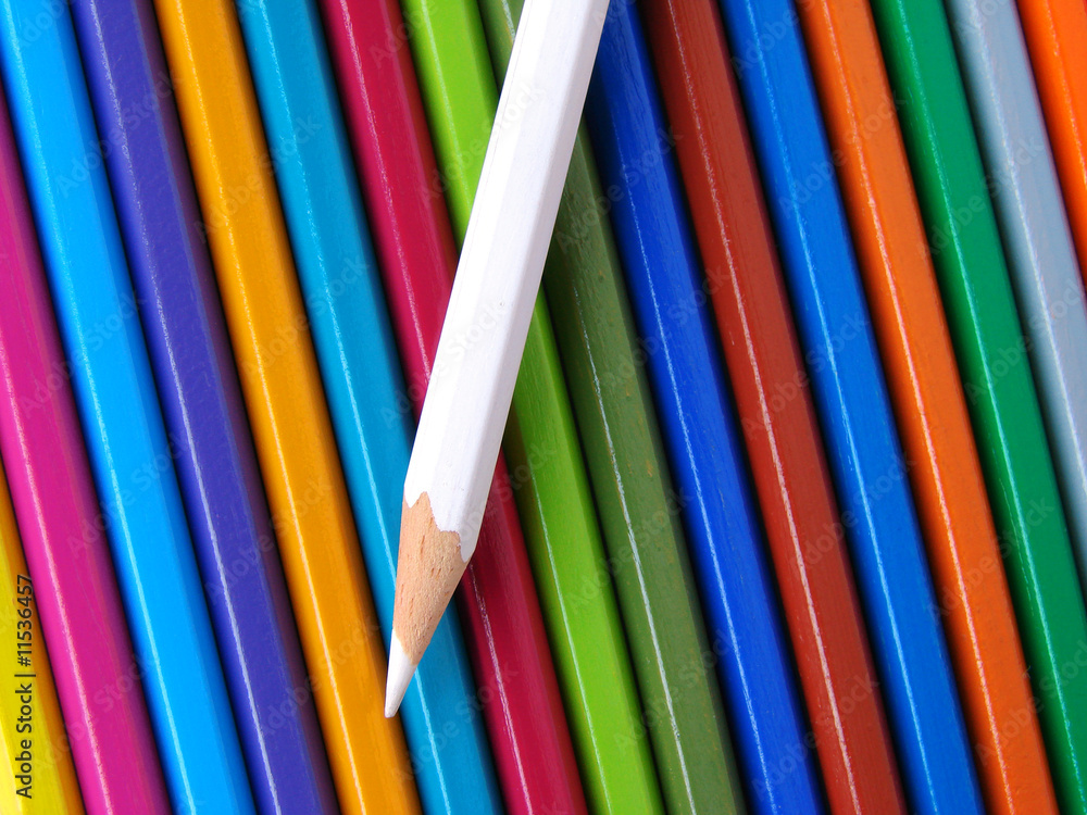 white pencil against colorful ones set white pencil against colorful ones set