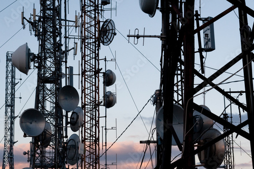 communications towers to the sunset