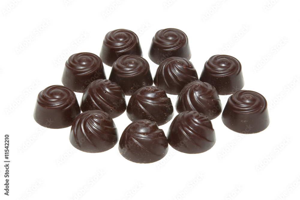 Delicious dark chocolate pralines isolated on white. Delicious dark chocolate pralines isolated on white.