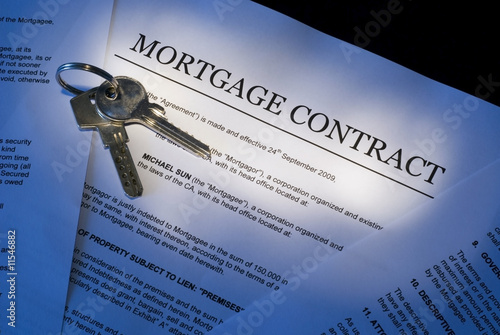 Mortgage contract with house keys photo