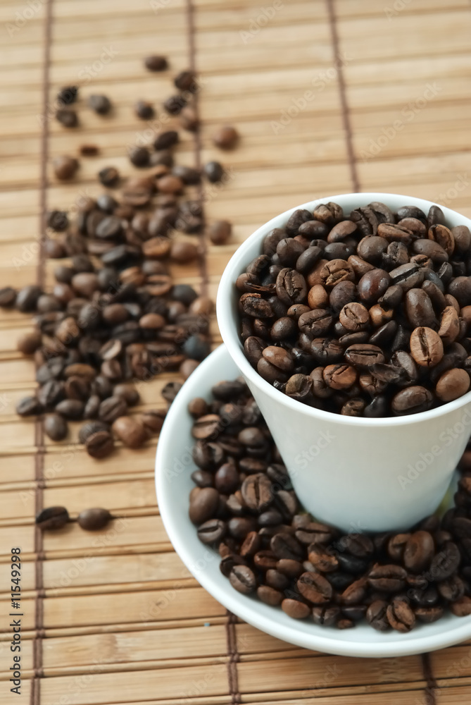 Cup with coffe beans Cup with coffe beans
