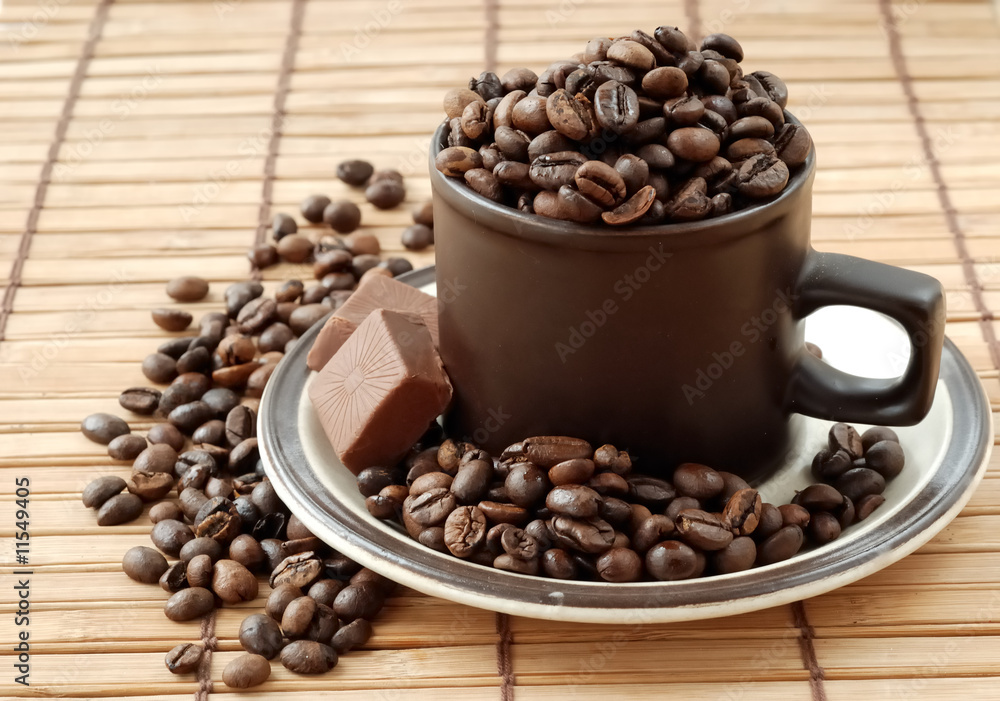 Cup with coffe beans Cup with coffe beans