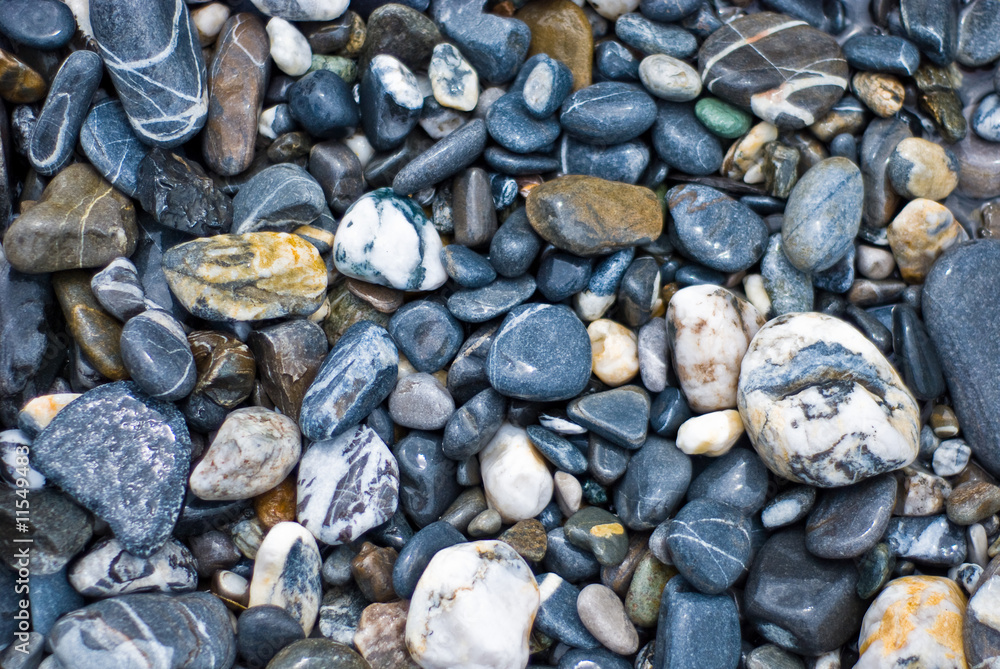 blue, grey, brown and white pebbles close up blue, grey, brown and white pebbles close up
