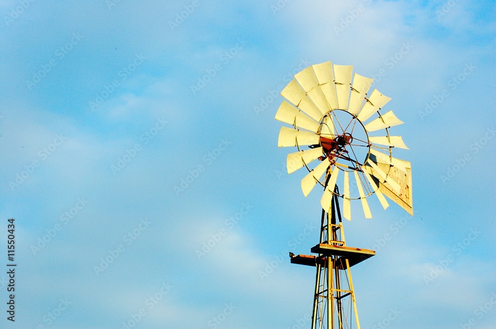 Old windmill with blue sky and clouds Old windmill with blue sky and clouds