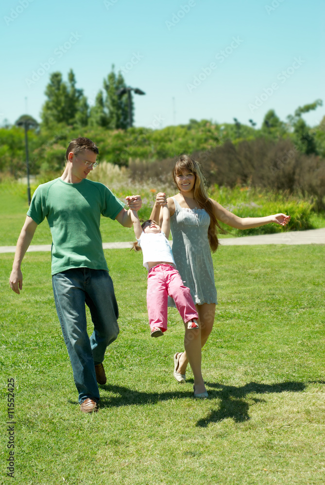 Happy family on walk in park