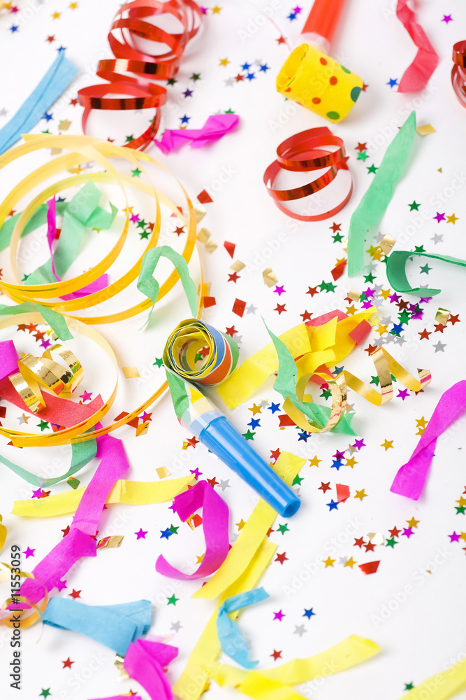 confetti and colorful blowers on white background