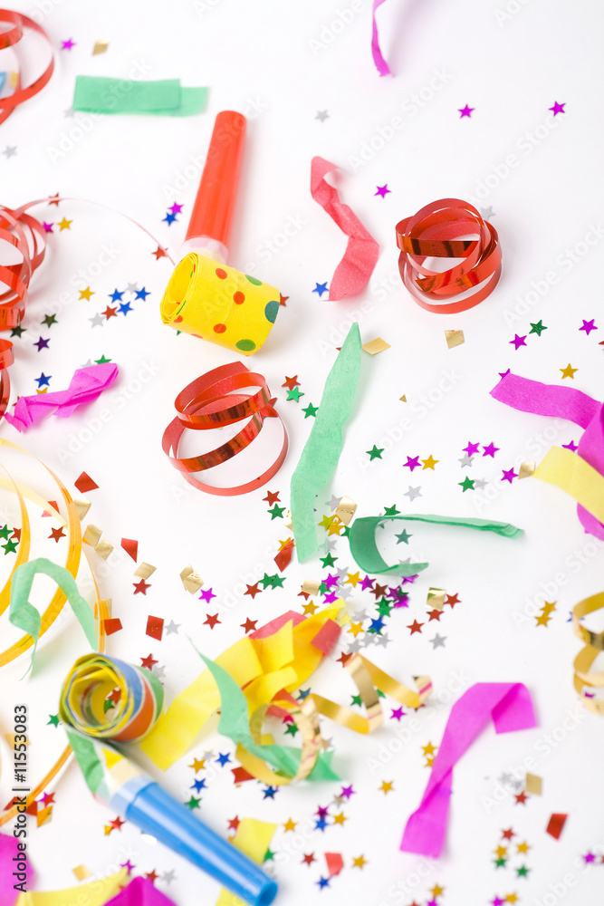 confetti and colorful blowers on white background confetti and colorful blowers on white background