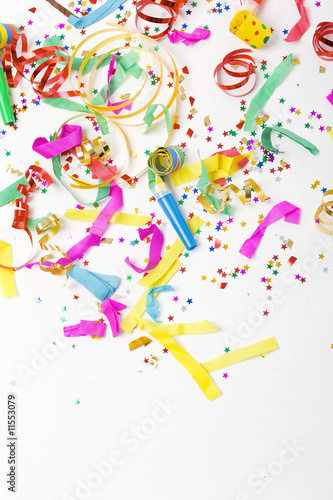 confetti and colorful blowers on white background © originalpunkt