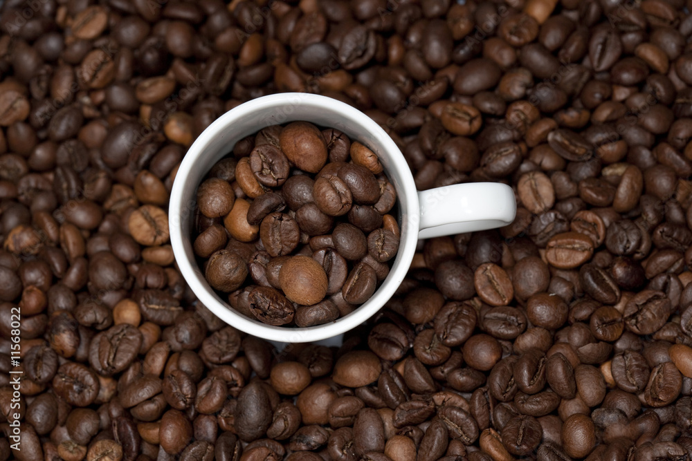 background with white cup and coffee beans