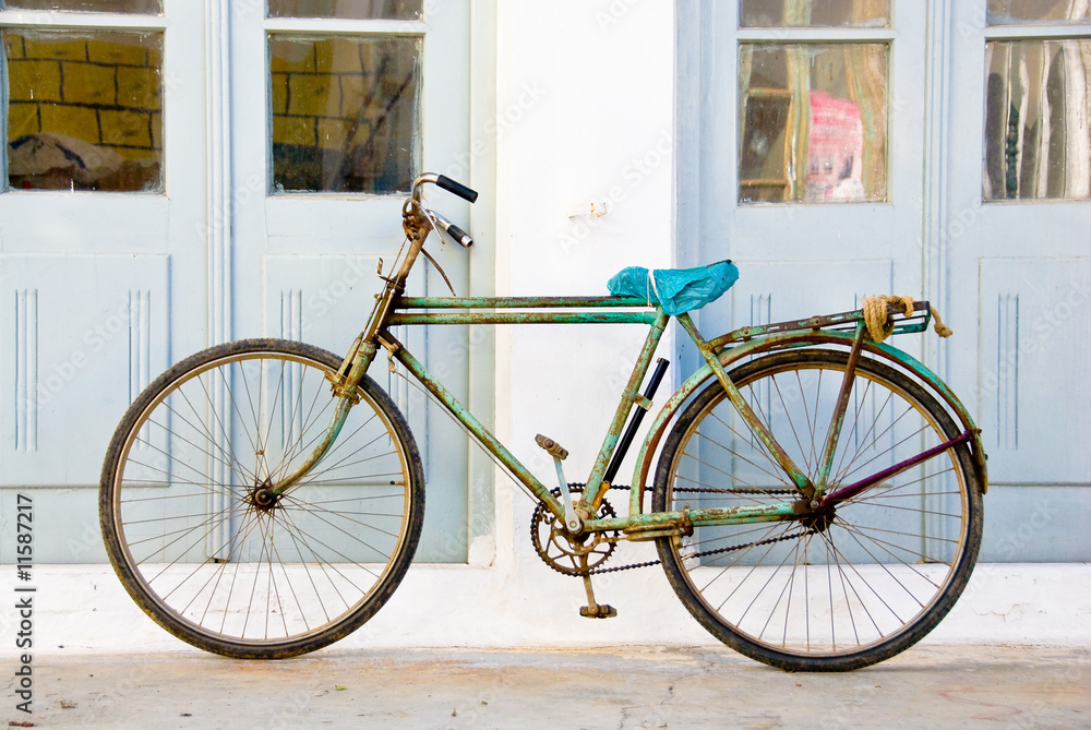 rusted green bicycle