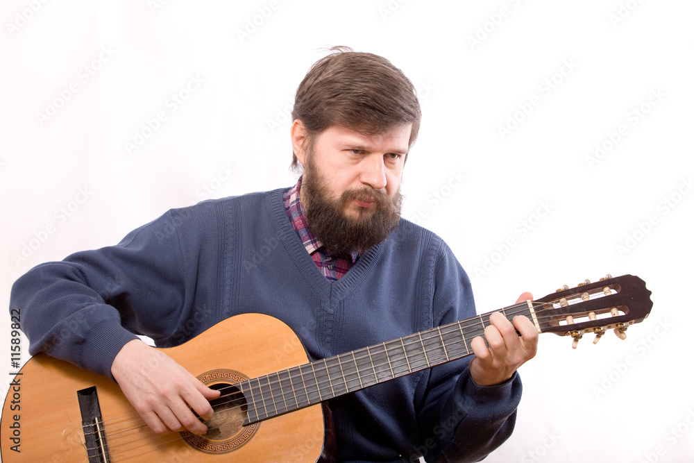 Obraz premium The man playing on guitar
