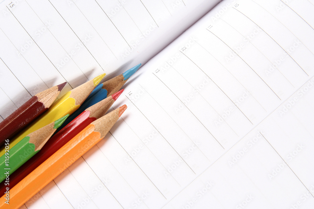 Color pencil and agenda Color pencil and agenda