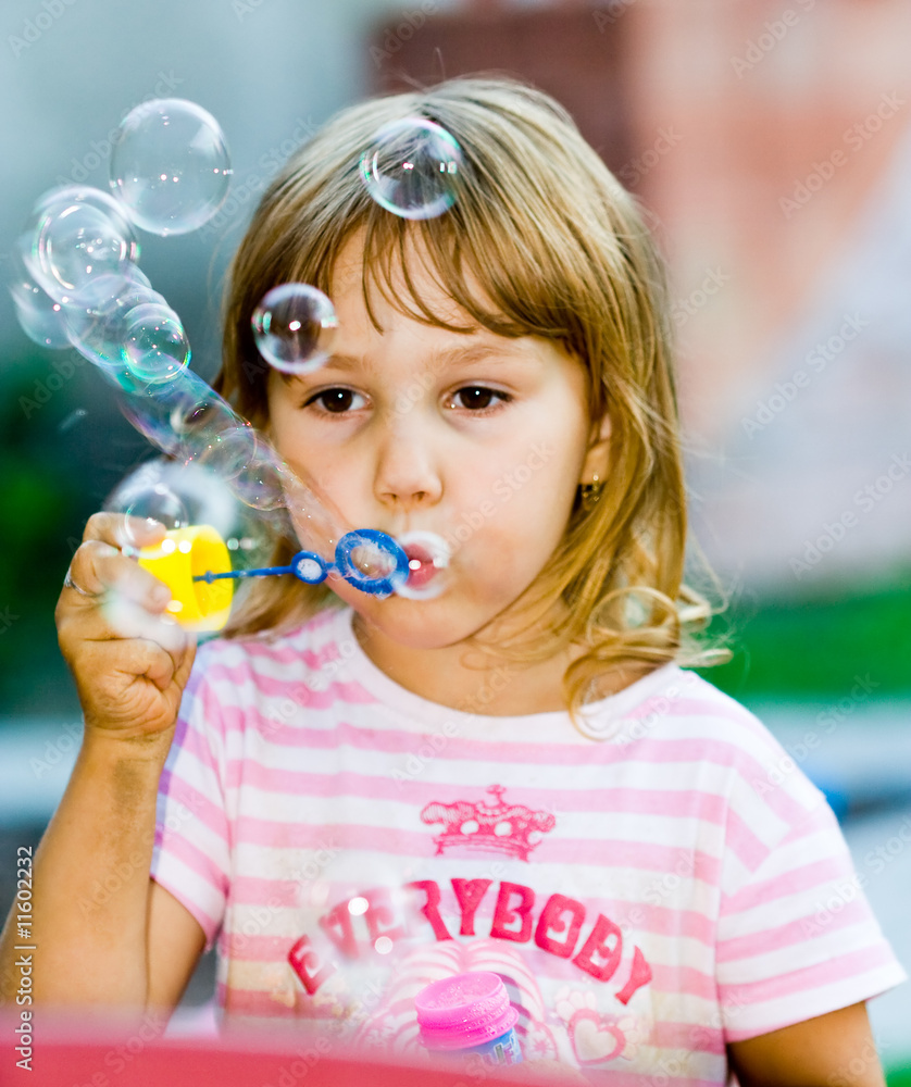 Girl blowing soap bubbles Girl blowing soap bubbles