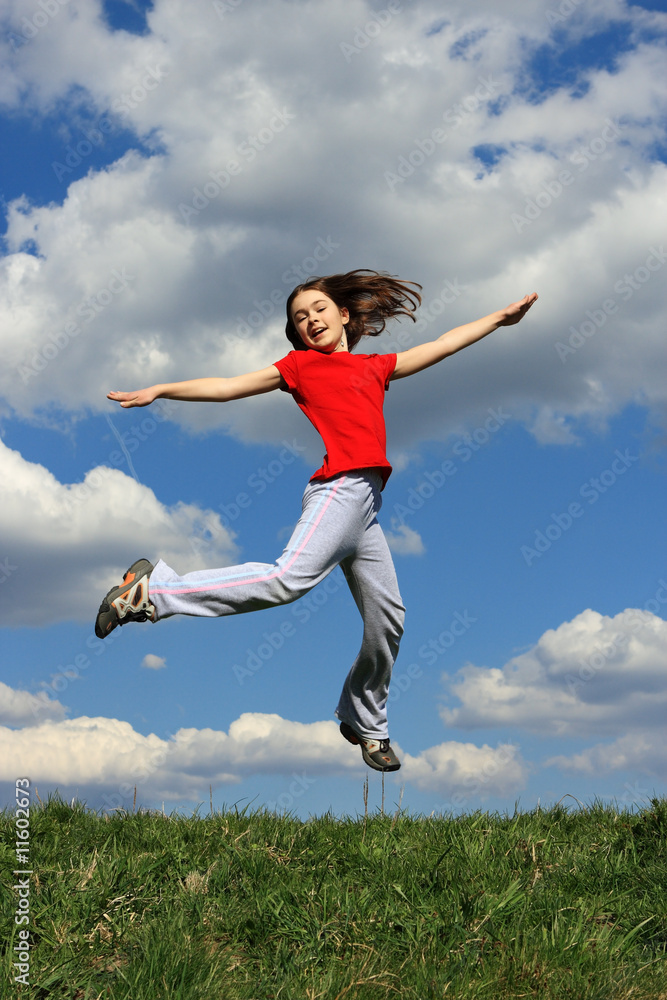 Girl jumping, running against blue sky Girl jumping, running against blue sky