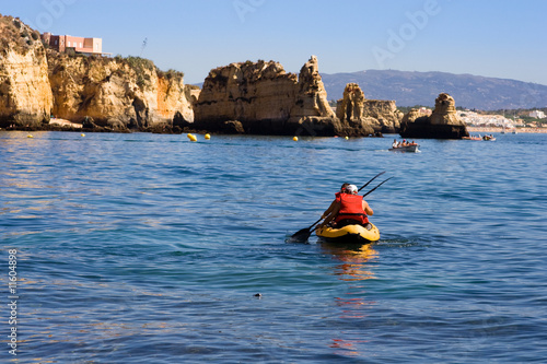 two persons are kayaking in sea,ocean at the morning