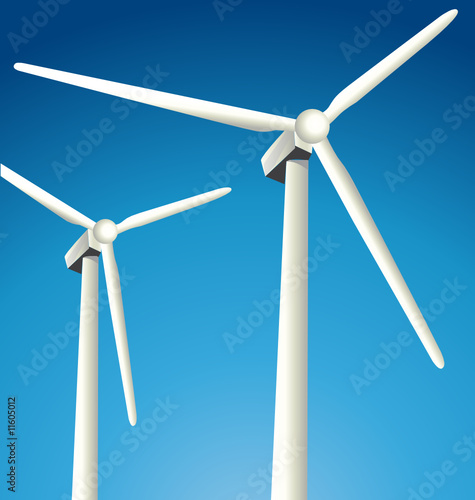 Two windmills on beautiful sky