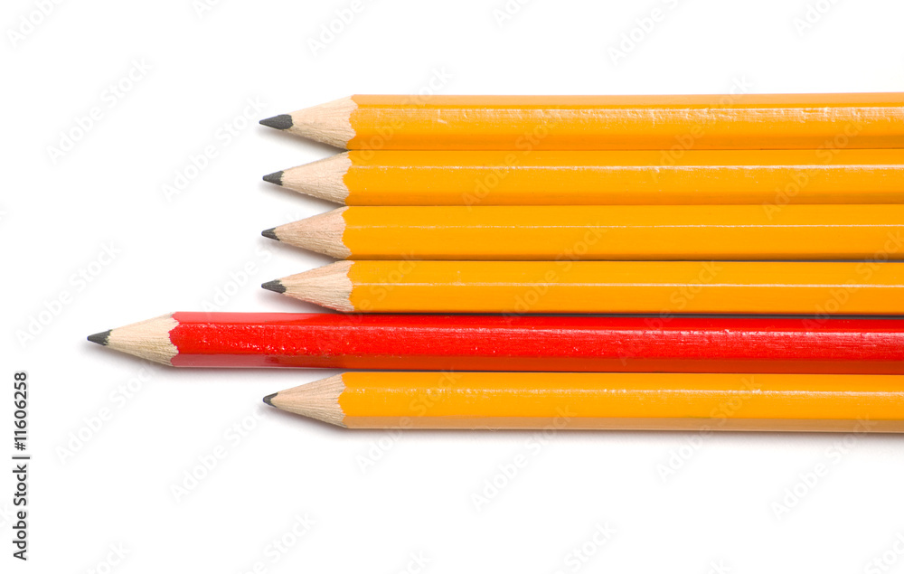 Fototapeta premium Yellow and red pencils point left
