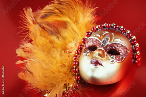 Fototapeta Naklejka Na Ścianę i Meble -  ornate carnival mask over textured metallic background