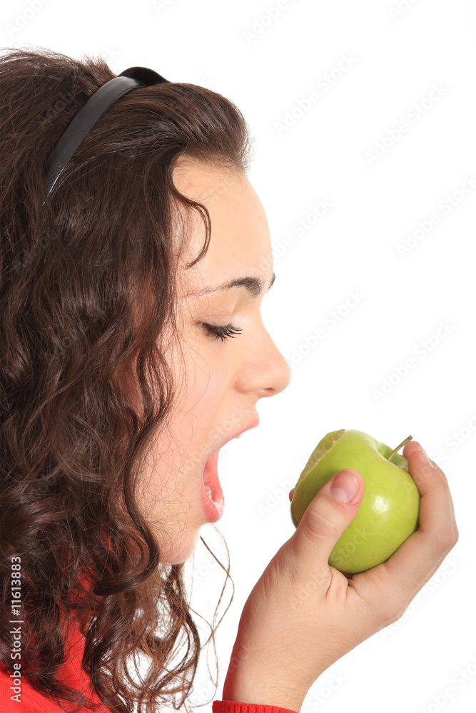 Portrait of a young girl eating an apple Portrait of a young girl eating an apple