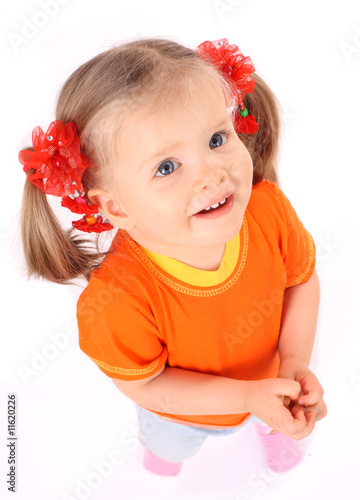 Baby girl in orange t-shirt.