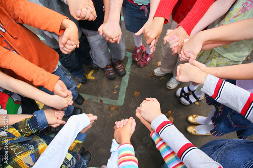 Circle from children, who are held for hands