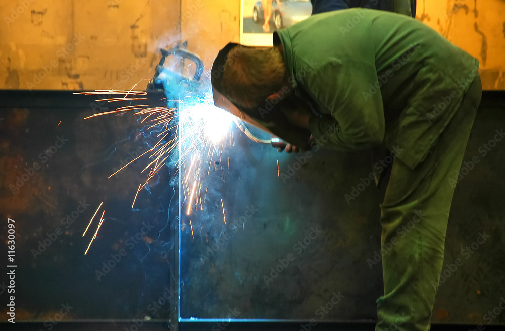 Manual welding at factory Manual welding at factory