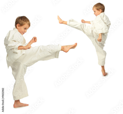 Karate boys kick by foot