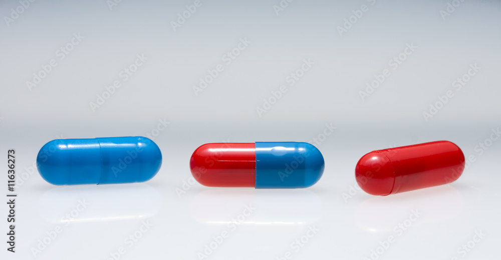 Row of three variegated pills Row of three variegated pills