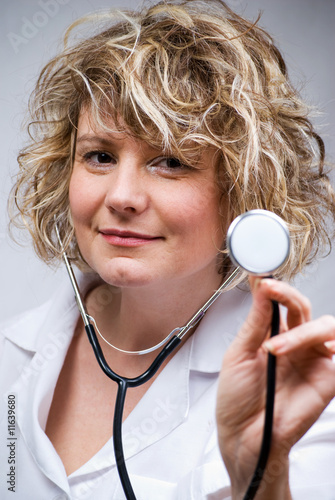smilimg doctor with stethoscope photo