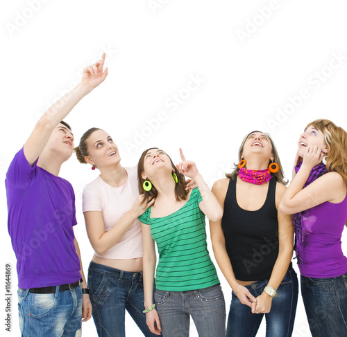 group of teenagers looking up and pointing towards something