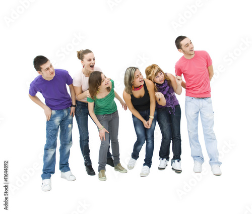 happy group of teenagers looking towards something