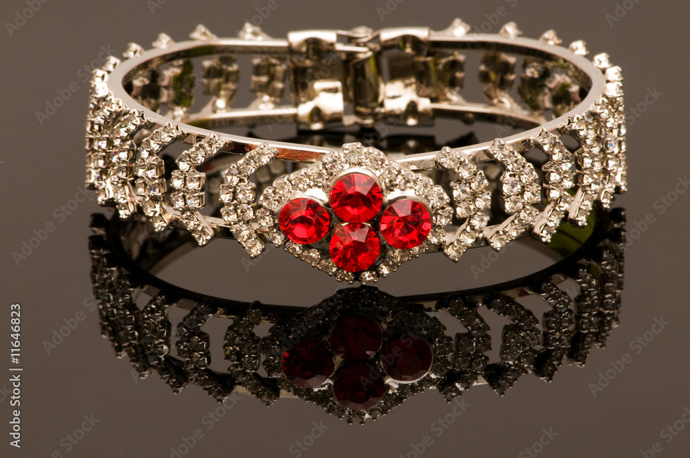Hand bracelet on the highly reflective background Hand bracelet on the highly reflective background