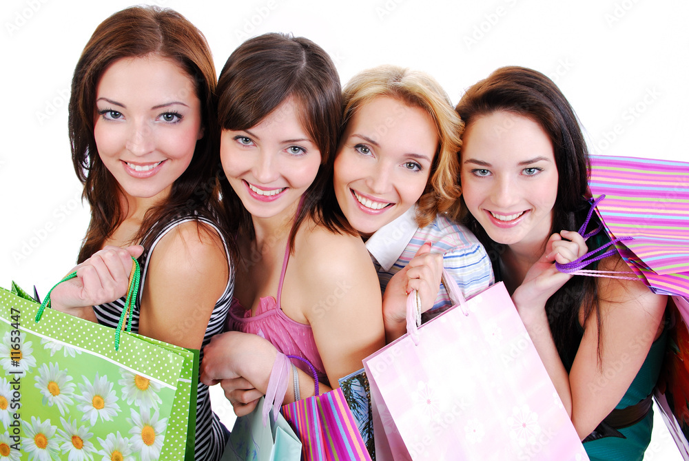 Happy cute smiling adult girls with shopping bags Happy cute smiling adult girls with shopping bags