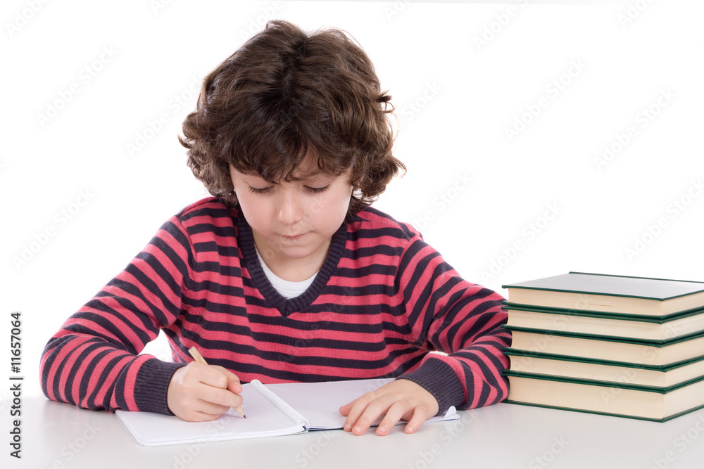 Adorable child writing in the school Adorable child writing in the school