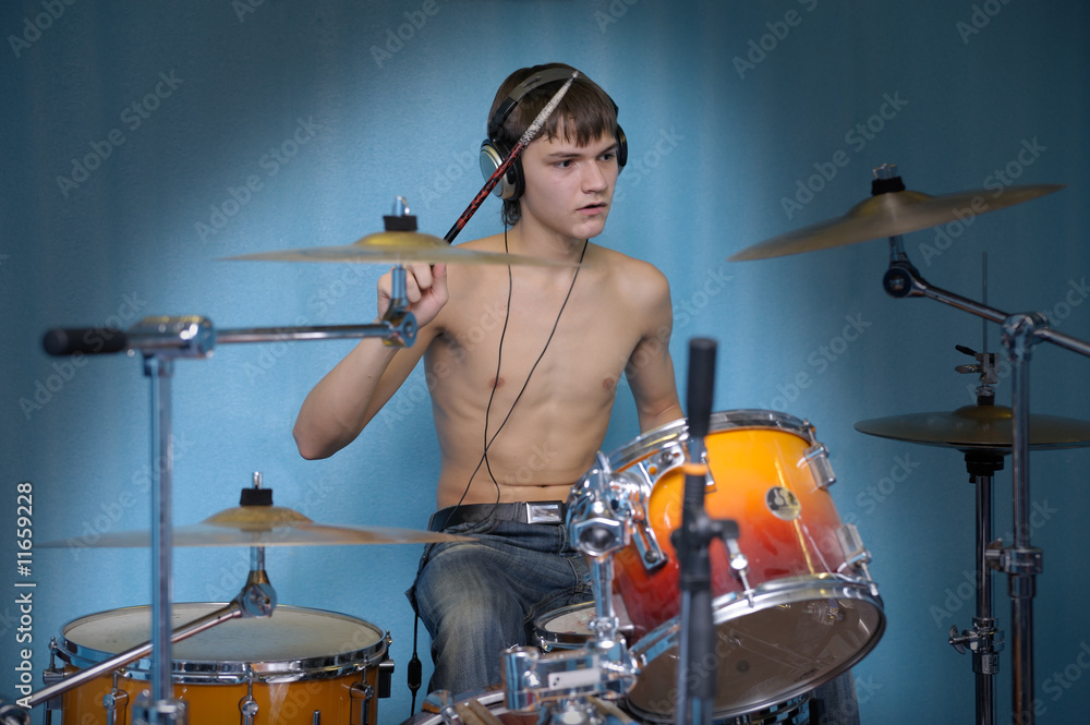 Fototapeta premium A young male drummer in action