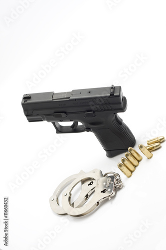 pistol and bullets isolated photo