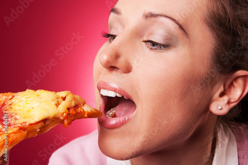 closeup portrait of beautiful woman and pizza