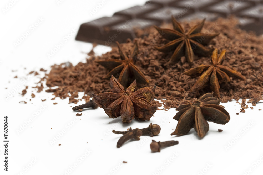 anise stars, grated chocolate and chocolate plate