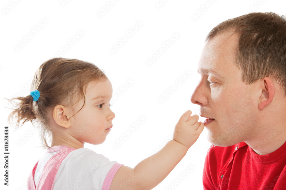 Little girl feeding dad Little girl feeding dad