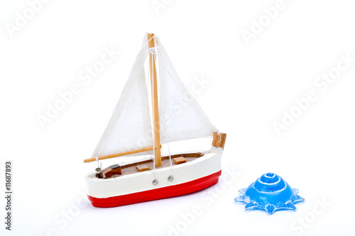 Toy boat and shell