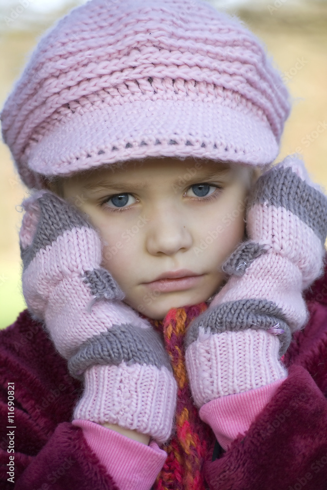 A girl in a pink cap A girl in a pink cap